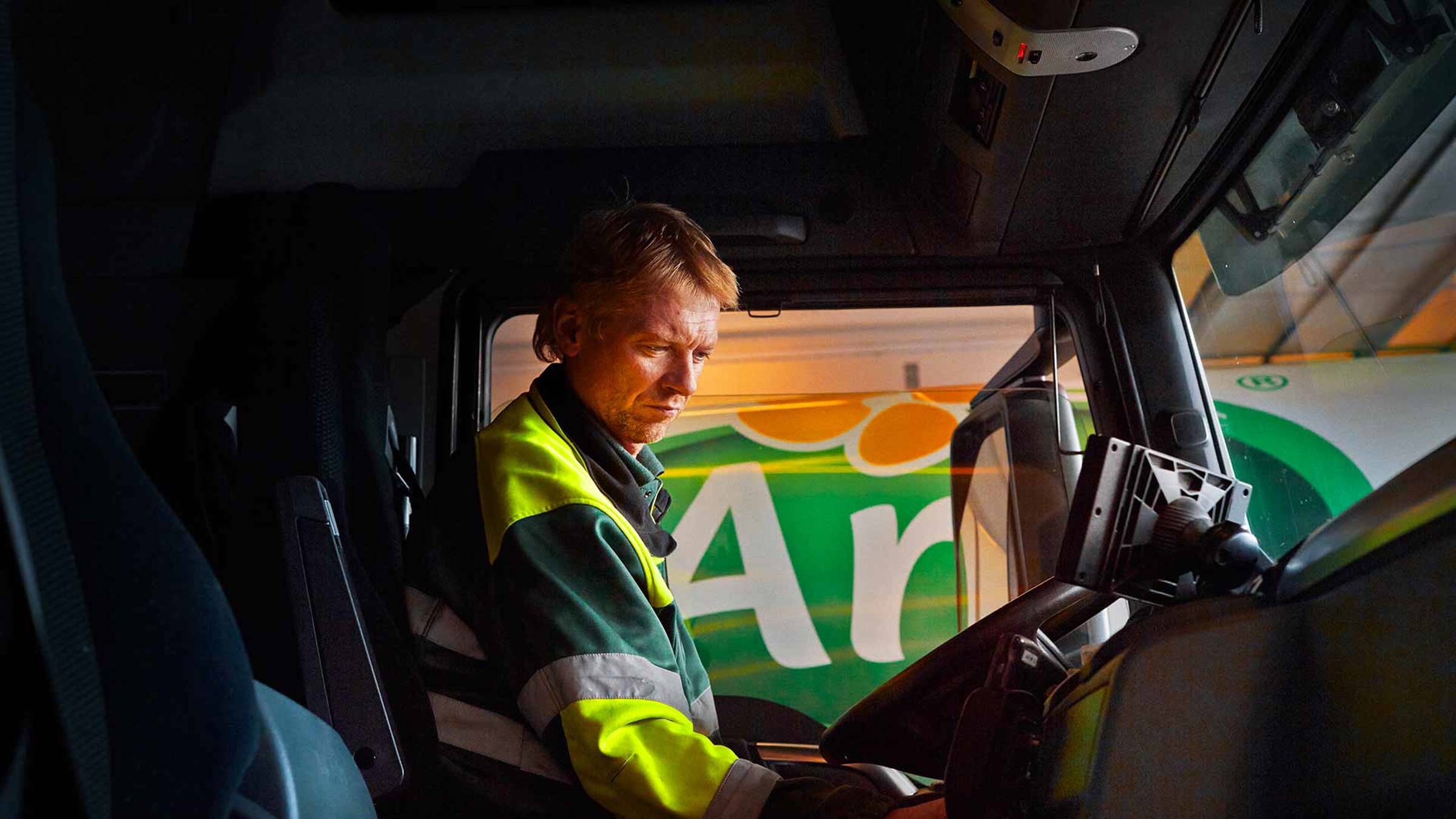 An Arla truck driver in his cab