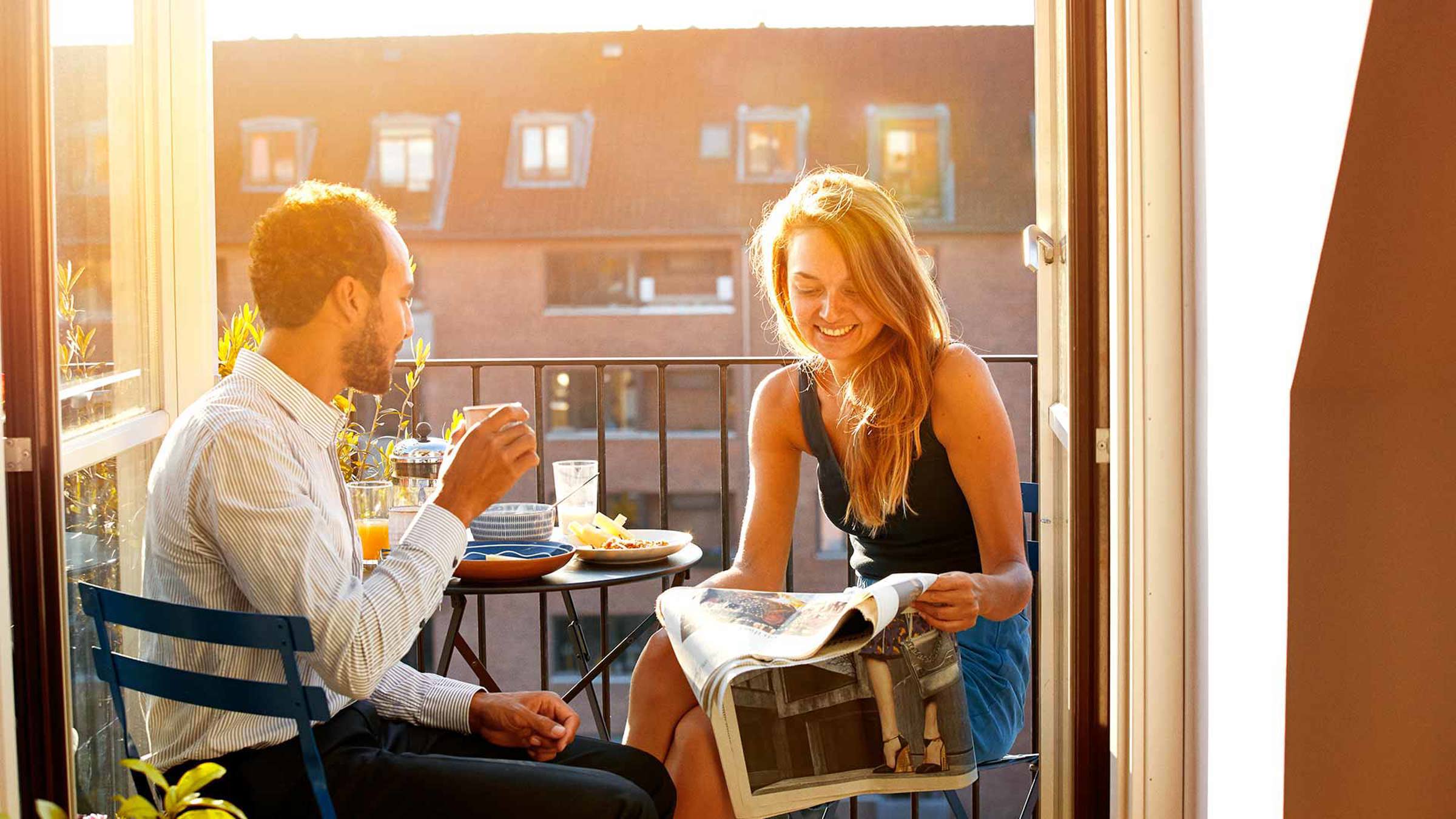 Couple dining together on a balcony