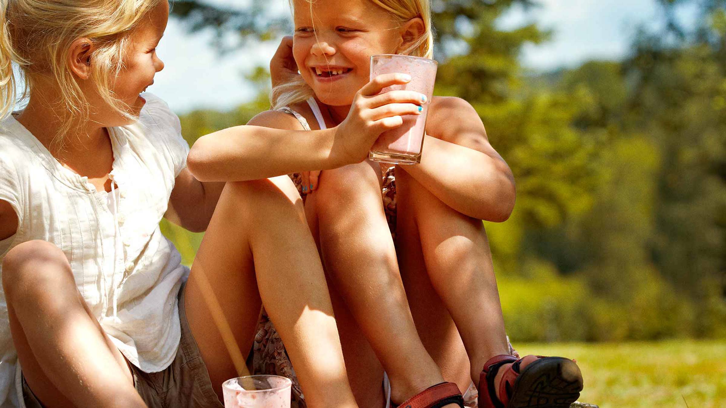 Girls sitting outside with smoothies