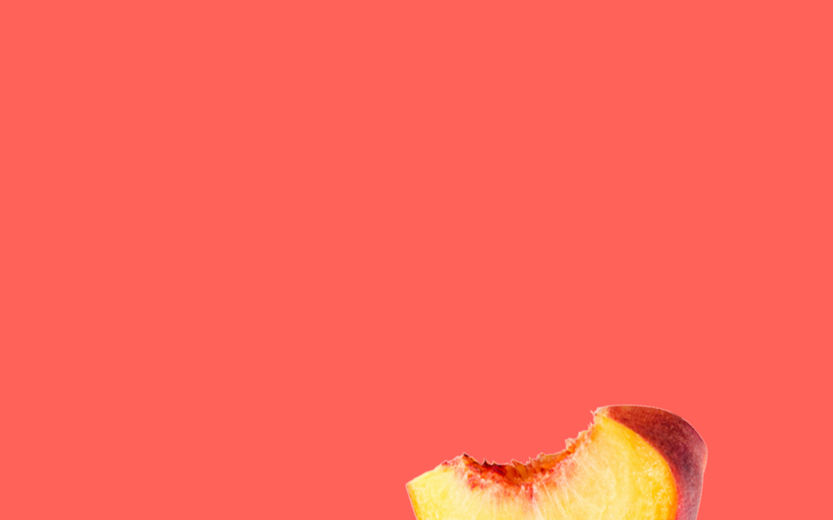 A peach slice on a red background.