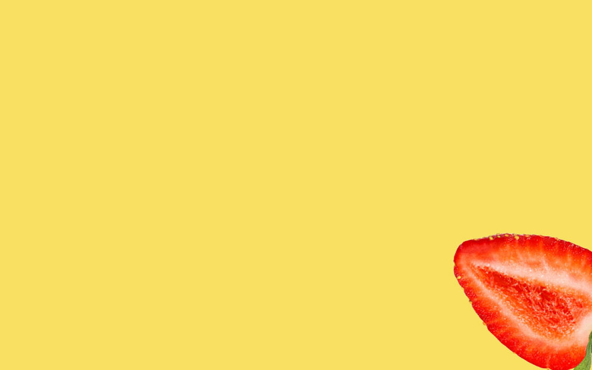 Strawberry slice on a yellow background