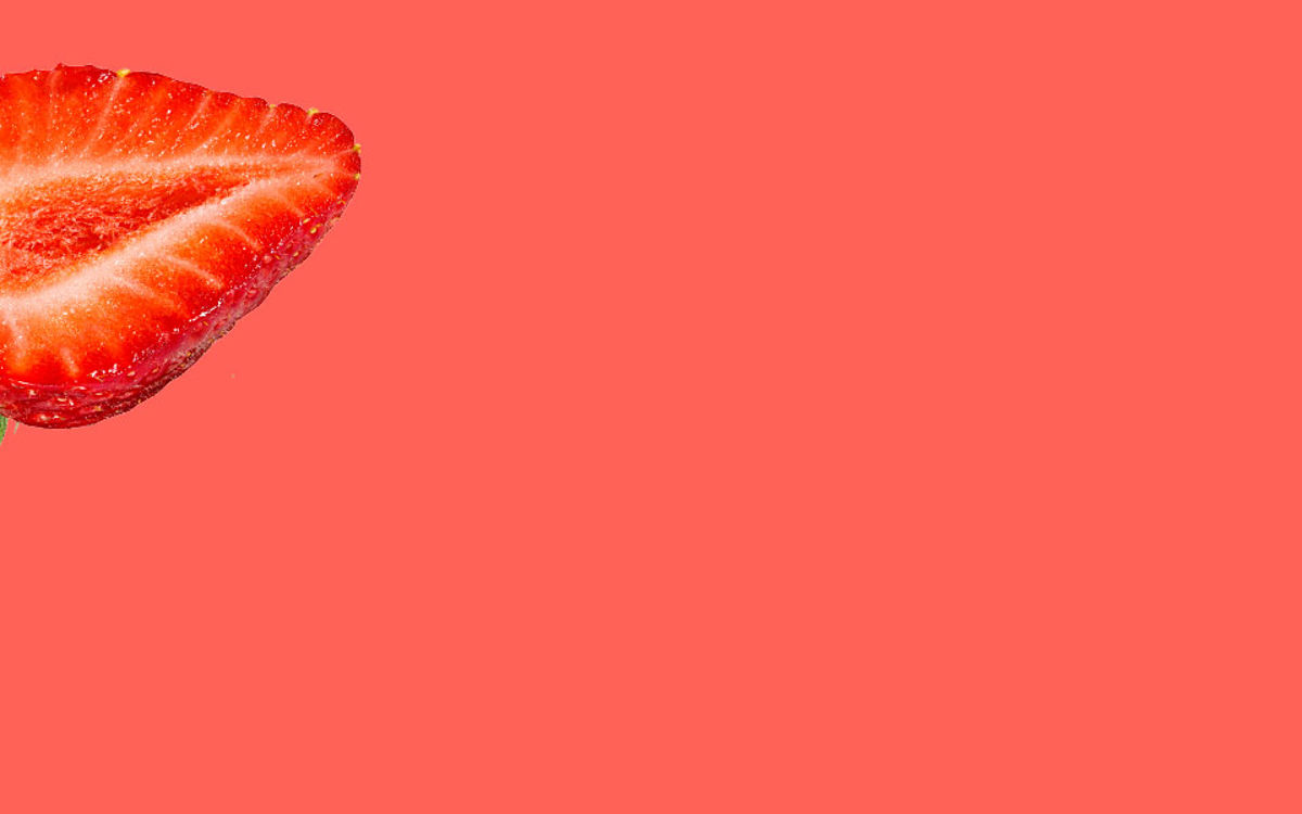 Strawberry slice on a red background