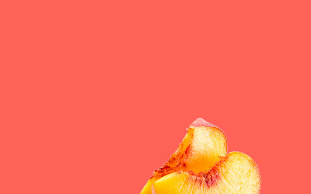 Peach slices on a red background