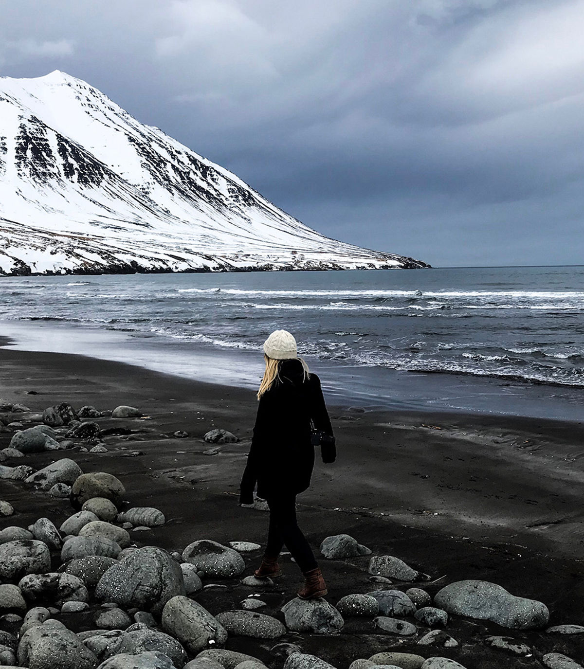 Woman strolling on the beach