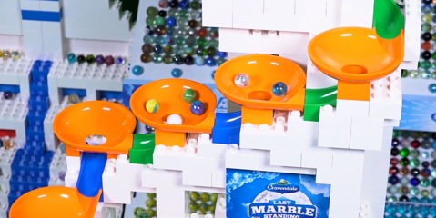 Marbles spinning in funnels