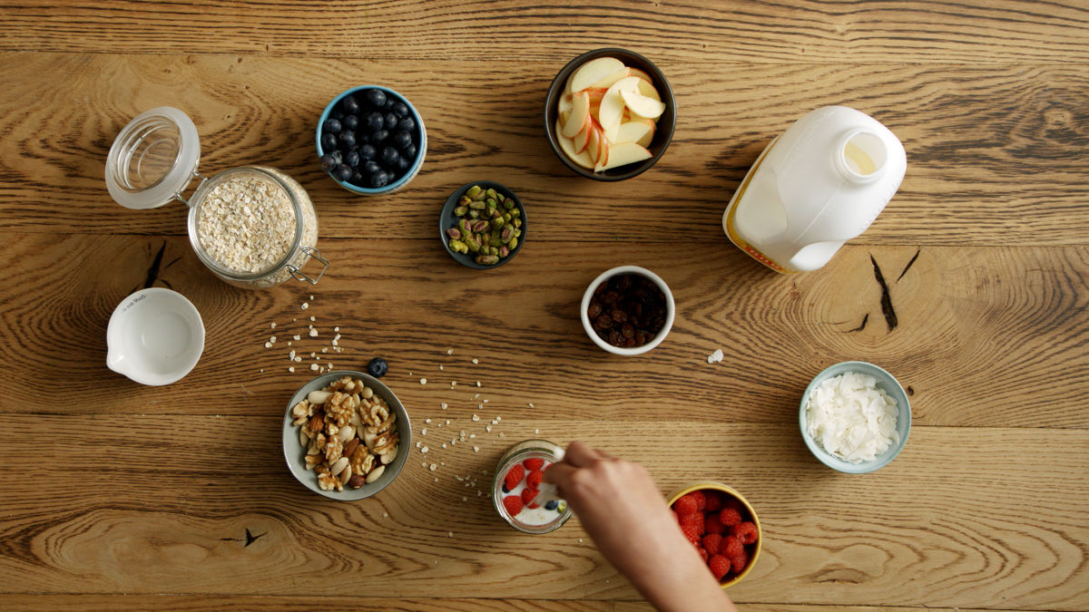 top oats and milk with fresh fruit and nuts