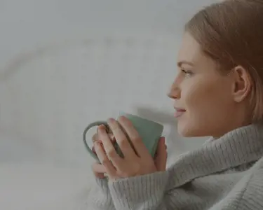 Woman drinking from a mug