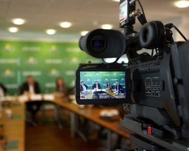 An Arla press meeting seen from the digital viewfinder of a video camera
