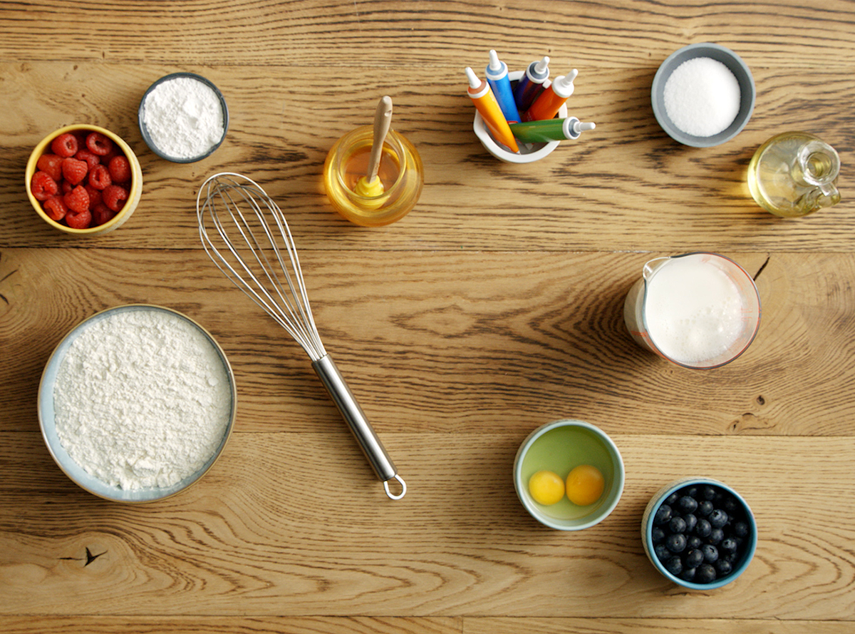 Ingredients for rainbow waffles laid out on a tabletop