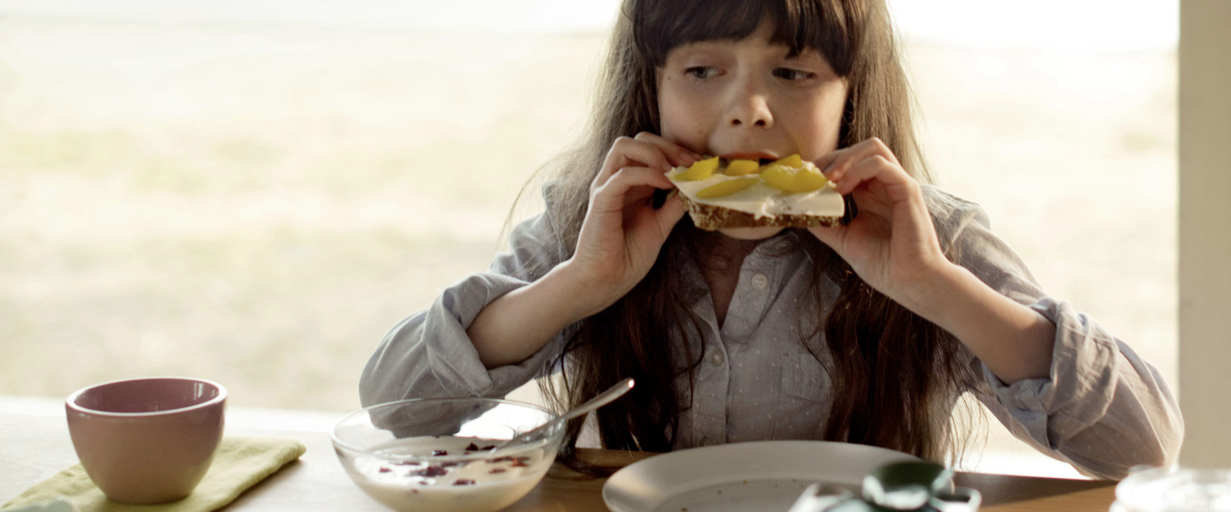 A girl eating toast