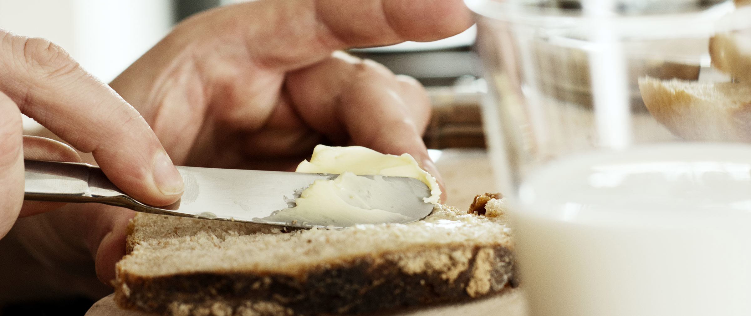 Butter being spread onto bread