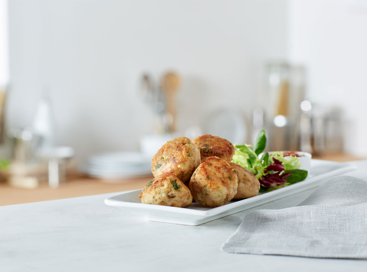 Fishcakes and salad on a plate