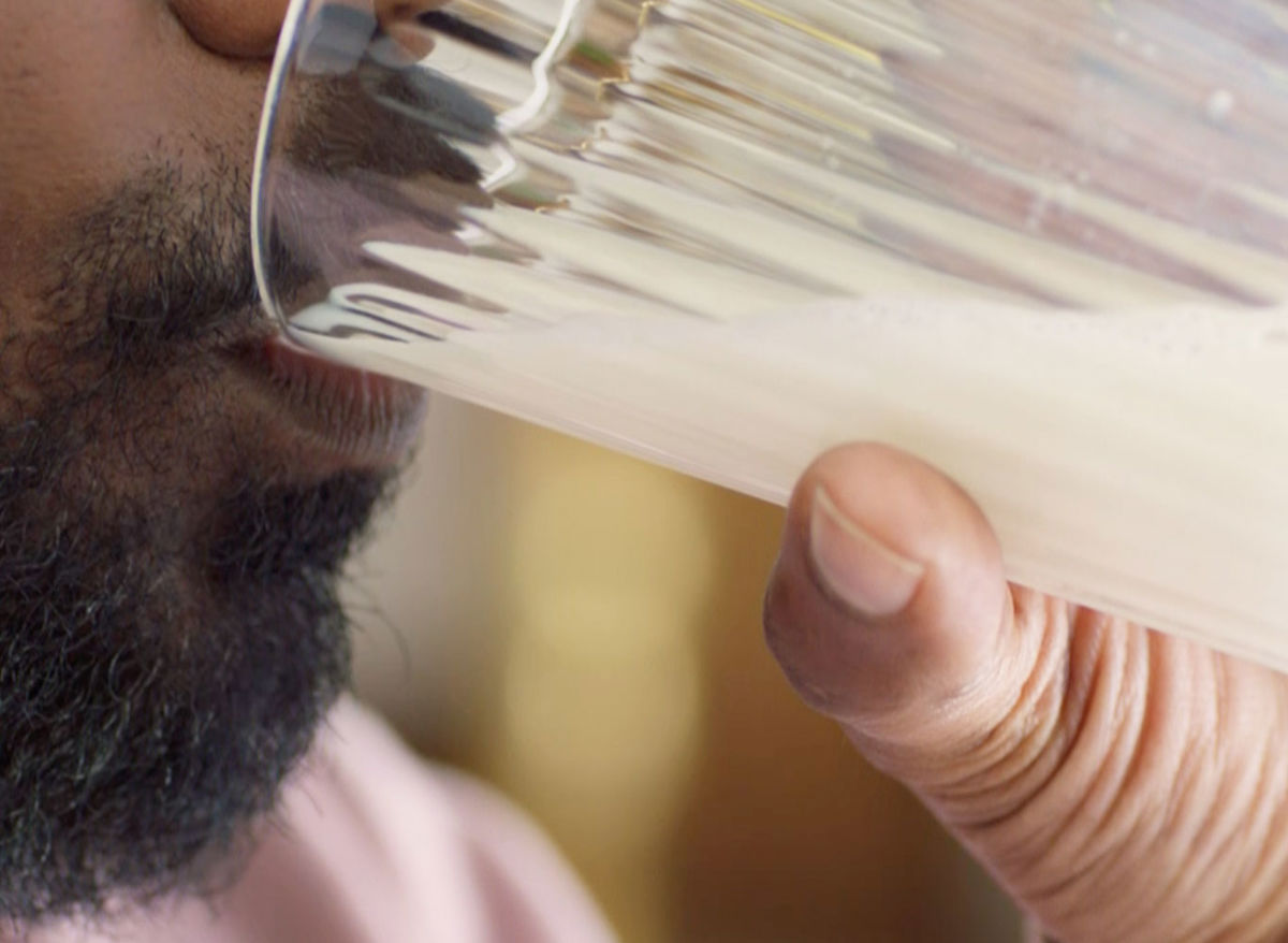 Close up on man drinking milk