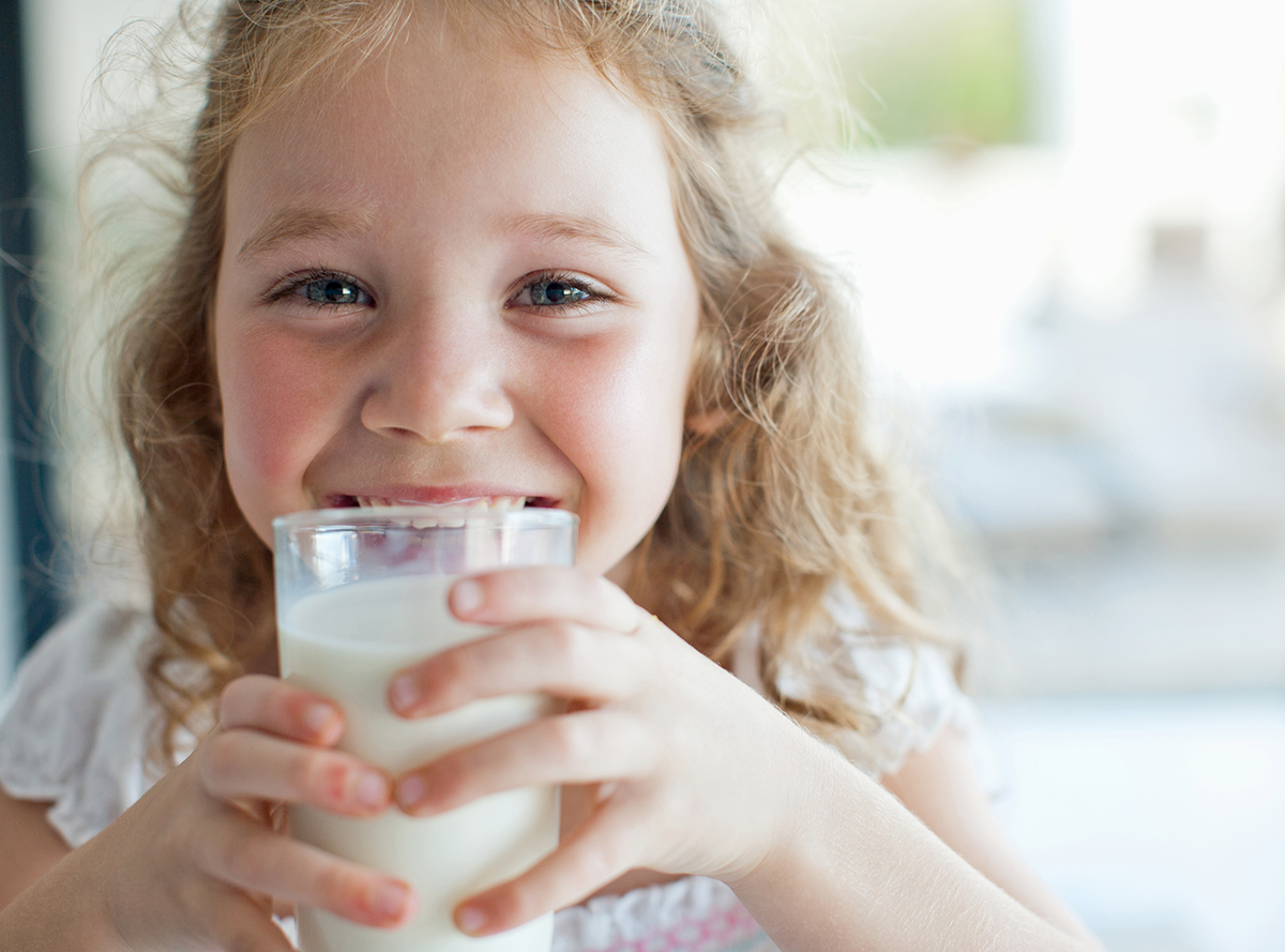 Girl drinking a glass of milk