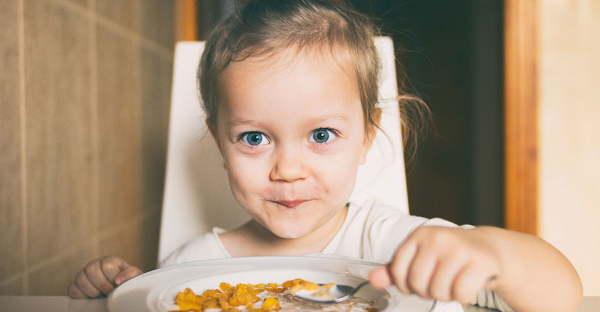 A little girl eating cereal