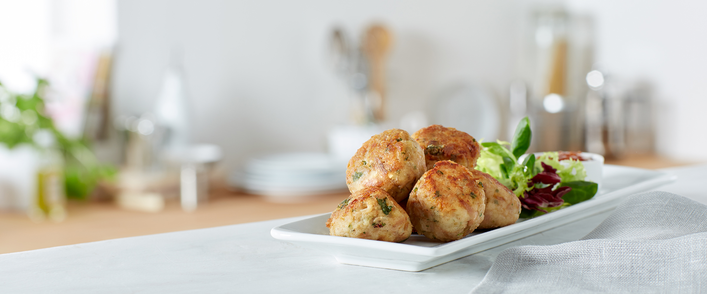 Fishcakes and salad on a plate