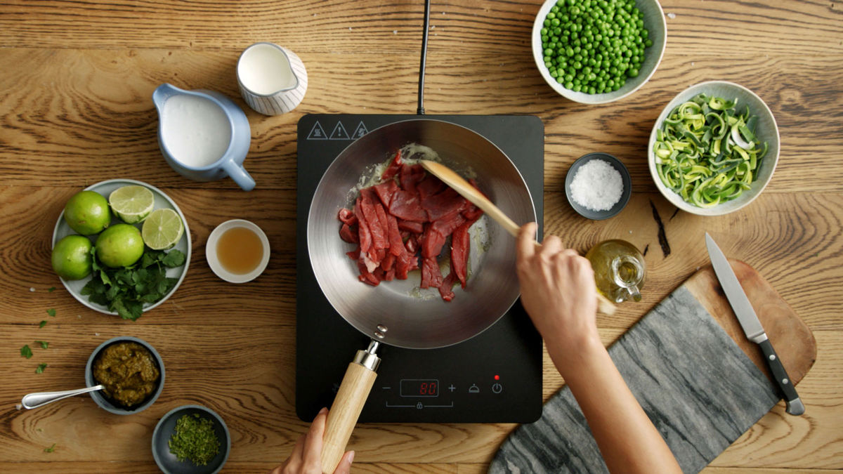 Beef being cooked in a wok