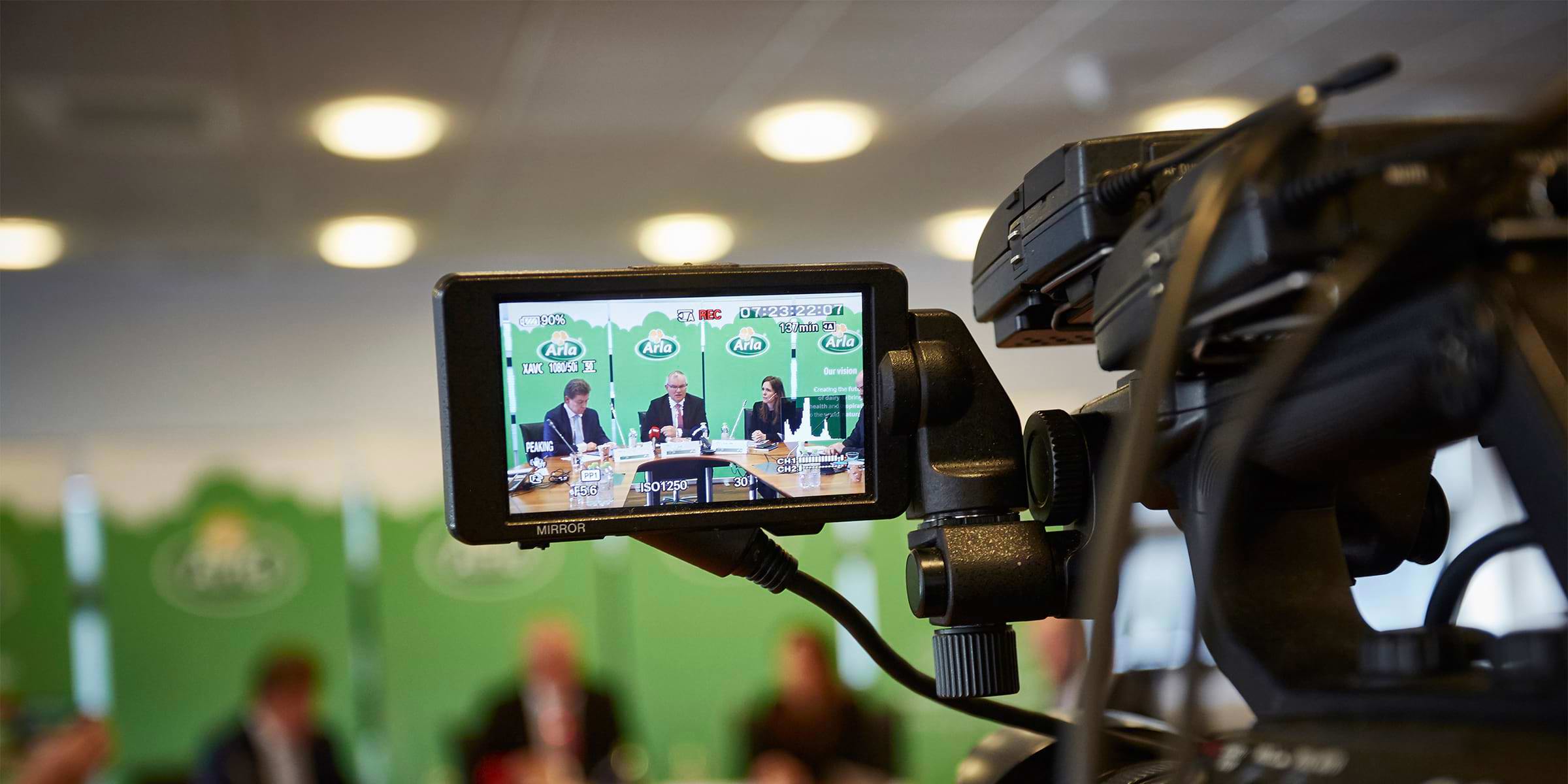 An Arla press meeting seen through the viewfinder of a camcorder