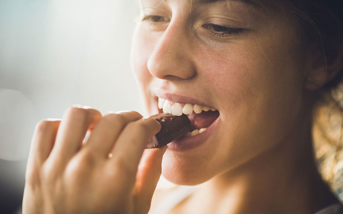 Woman eating chocolate