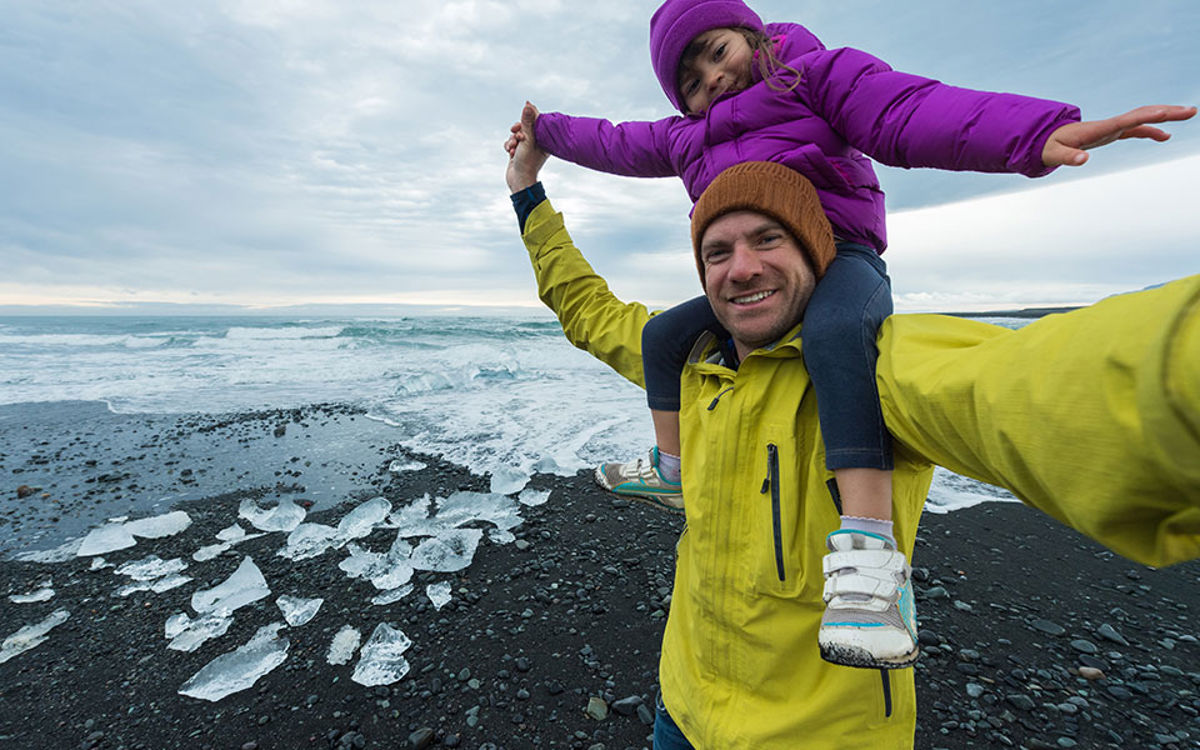 Daughter riding her dads shoulders